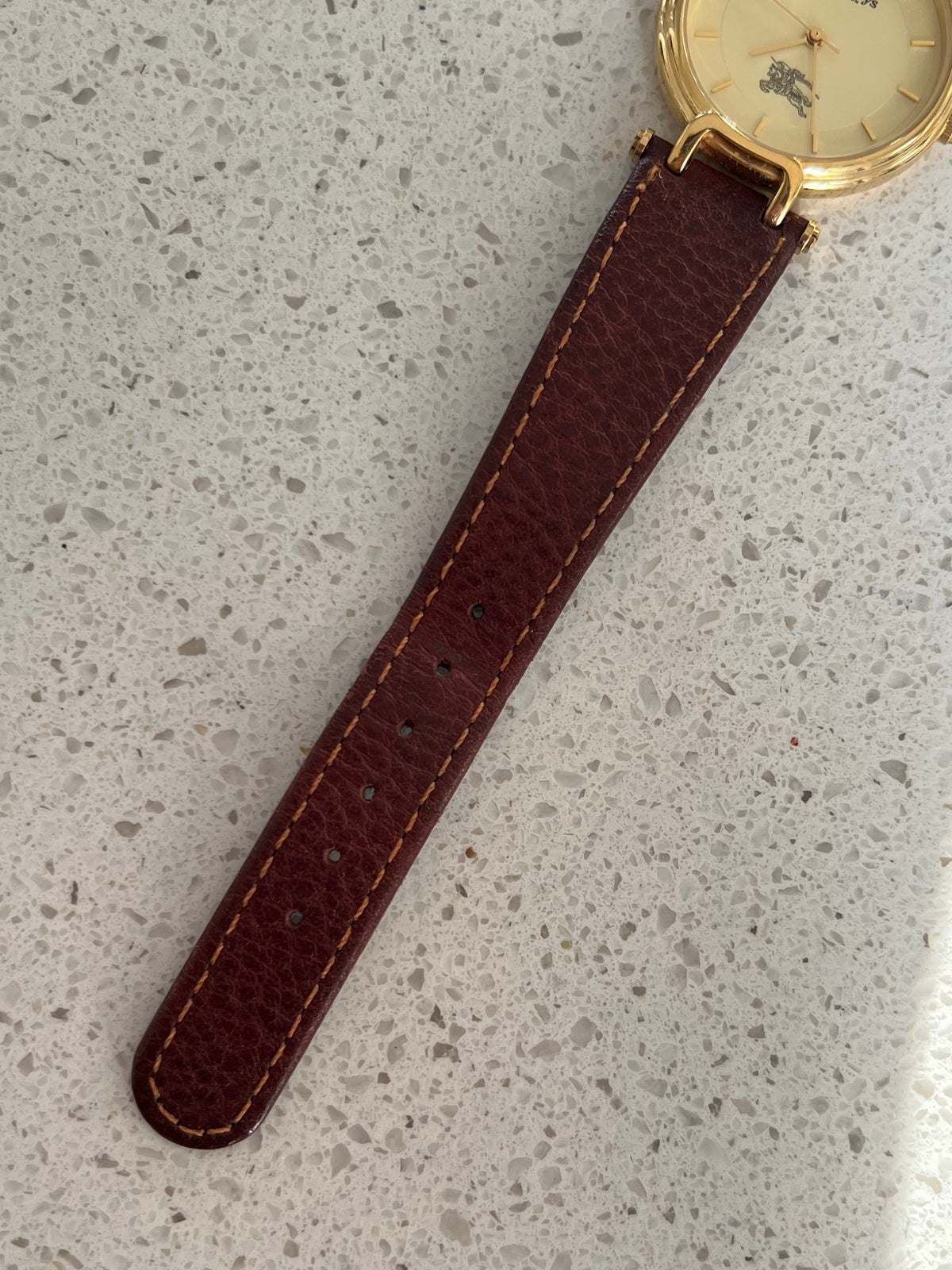 Detail of the original Burberrys leather strap and signed clasp.