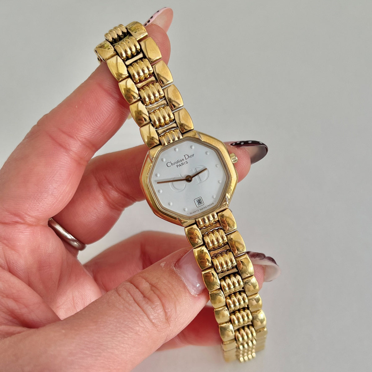 Christian Dior 48.153 women’s watch with white dial and gold tone bracelet