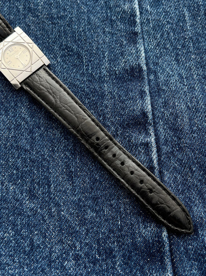 Black textured leather strap and adjustment holes on the Christian Dior Cannage women’s steel watch