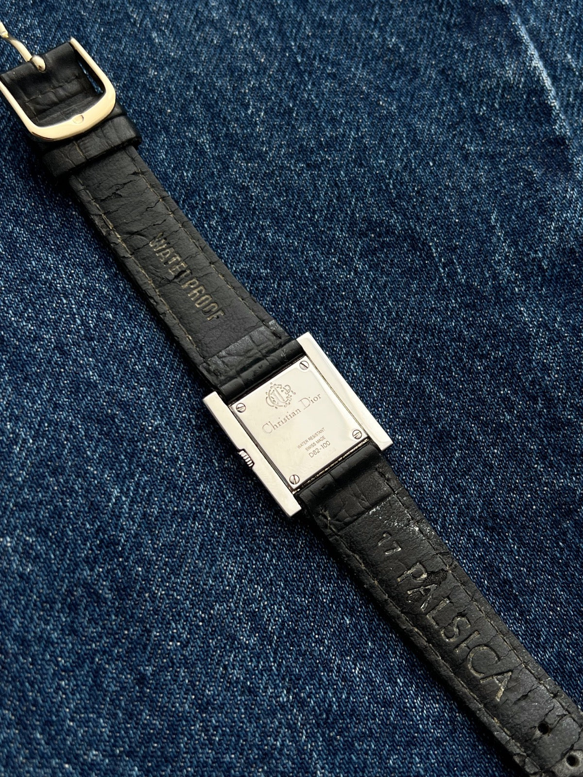 Christian Dior Cannage D82-100 steel watch caseback with four screws and signed markings