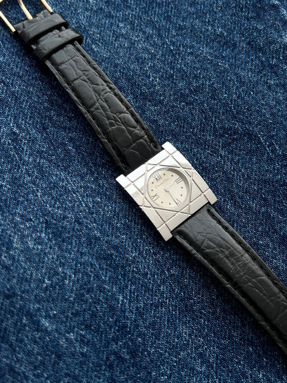 Angled close view of the Christian Dior Cannage women’s silver dial watch and engraved square steel case