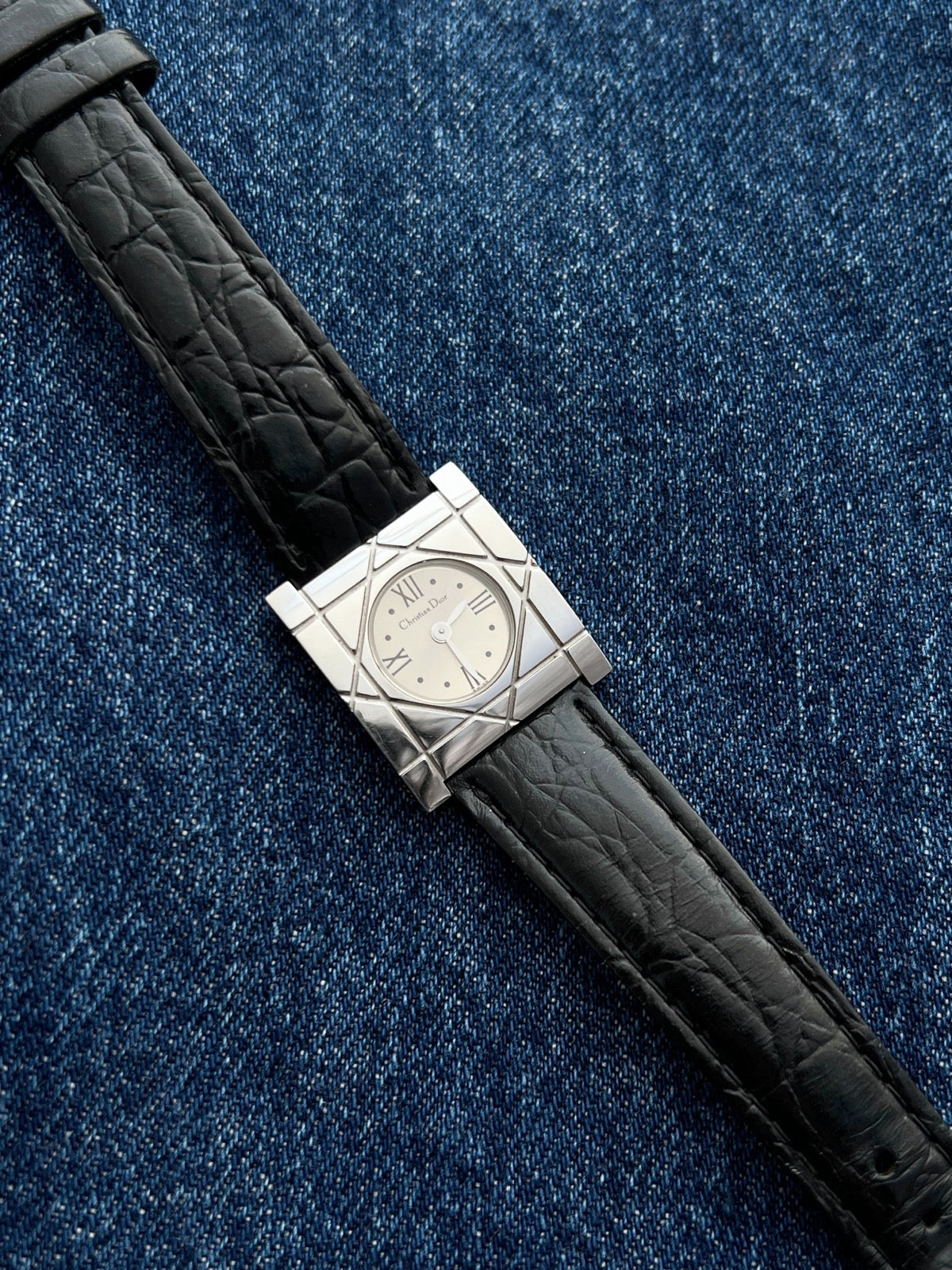 Christian Dior Cannage women’s square stainless steel watch with silver Roman dial and black textured leather strap, front view