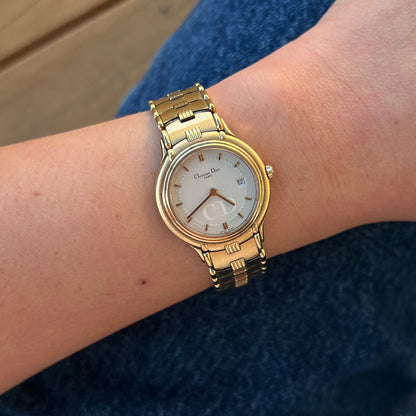 Christian Dior women's watch with silver white CD monogram dial, date window and gold tone bracelet