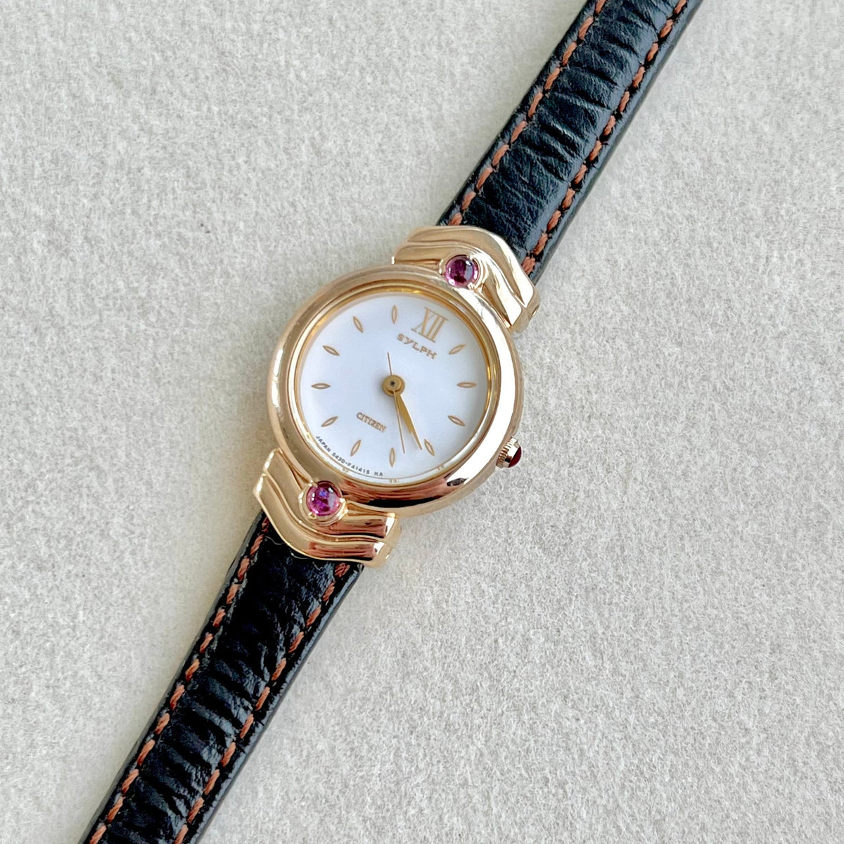 Citizen Gold Toned Women's Watch with Purple Stone, product photograph 1.