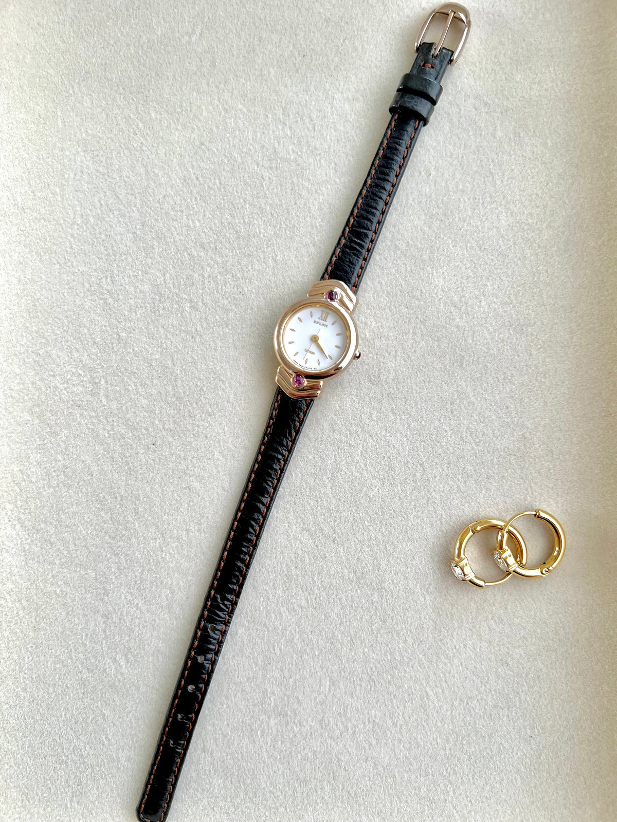 Citizen Gold Toned Women's Watch with Purple Stone, angled view of a vintage women's watch at Gilded Hour.