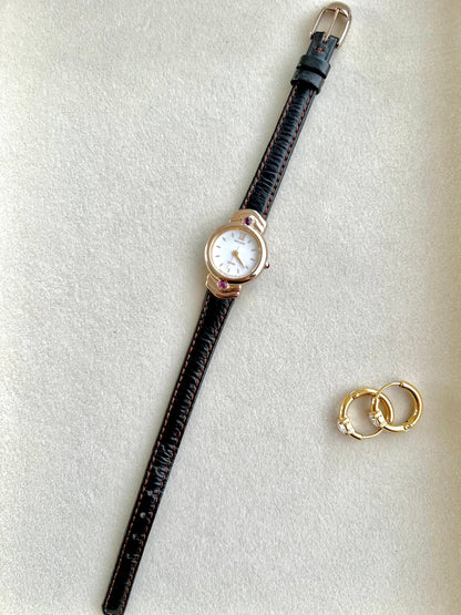 Citizen Gold Toned Women's Watch with Purple Stone, angled view of a vintage women's watch at Gilded Hour.