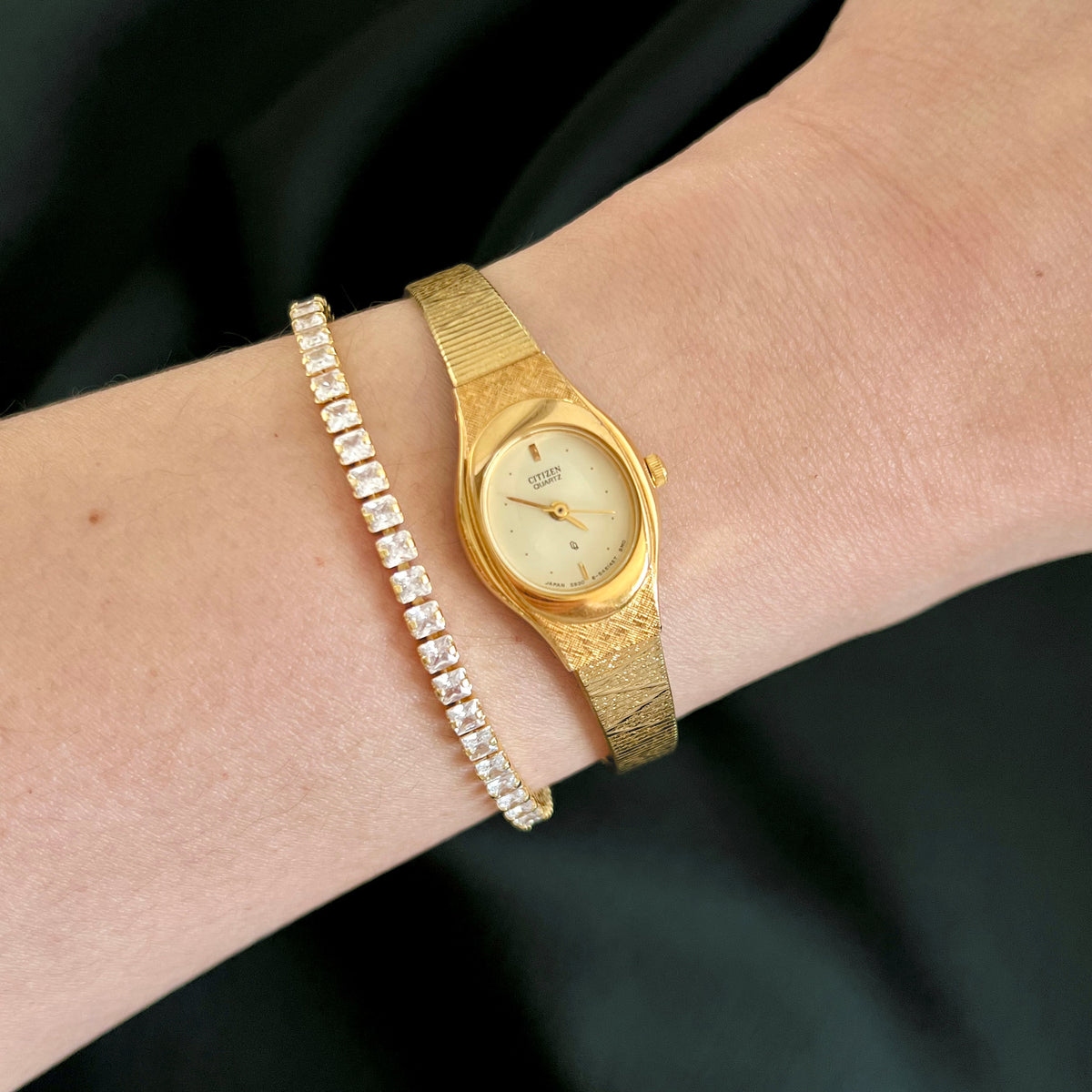 Citizen CQ 5930-S25350 champagne dial gold-tone watch worn on the wrist