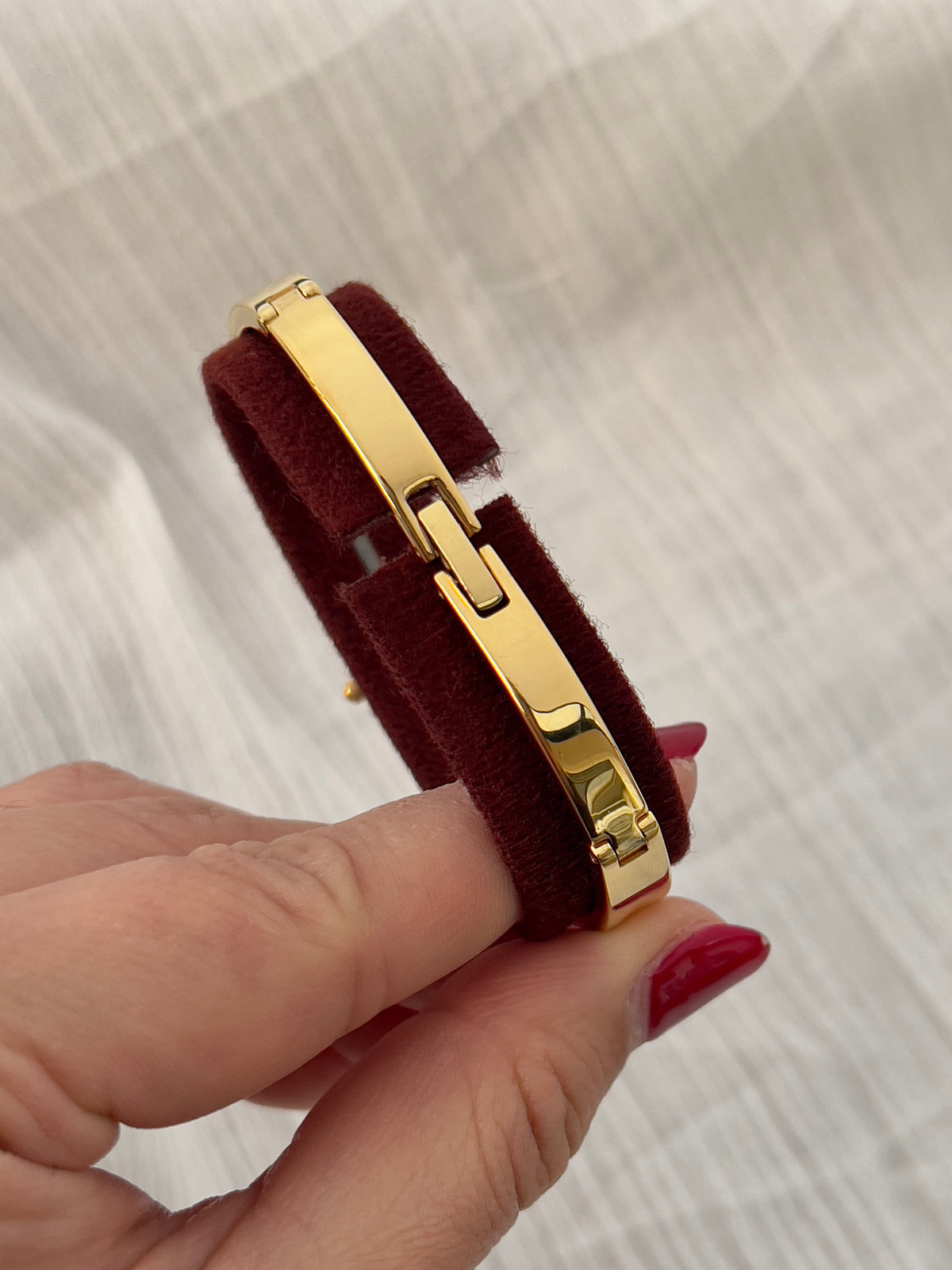 Citizen Chere Women's Gold Bangle Watch — detail of the case and band.