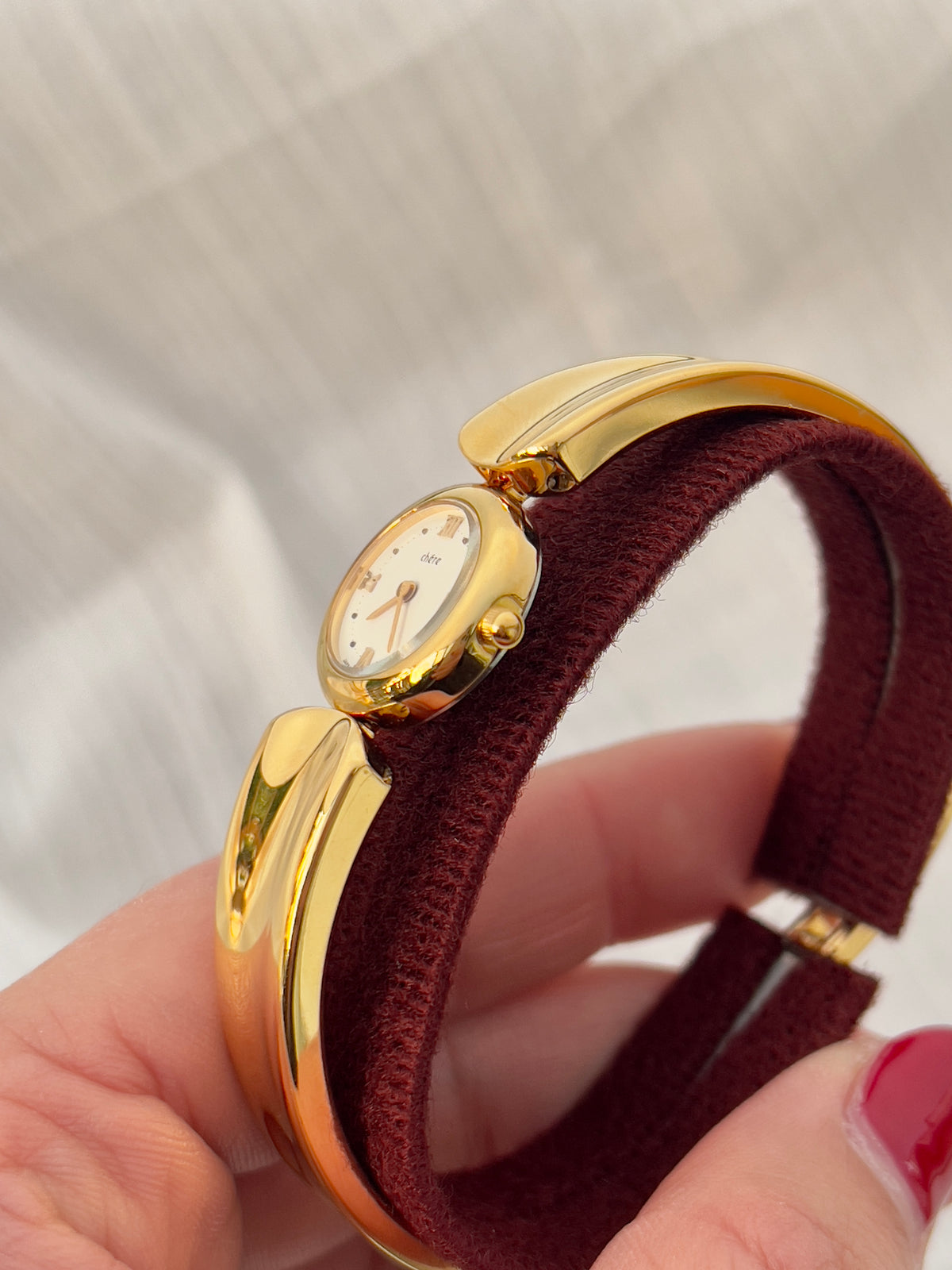 Citizen Chere Women's Gold Bangle Watch — close view of the watch band and clasp.