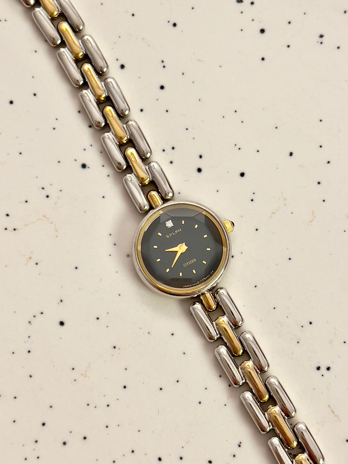 Citizen black dial two-tone women's bracelet watch with faceted crystal