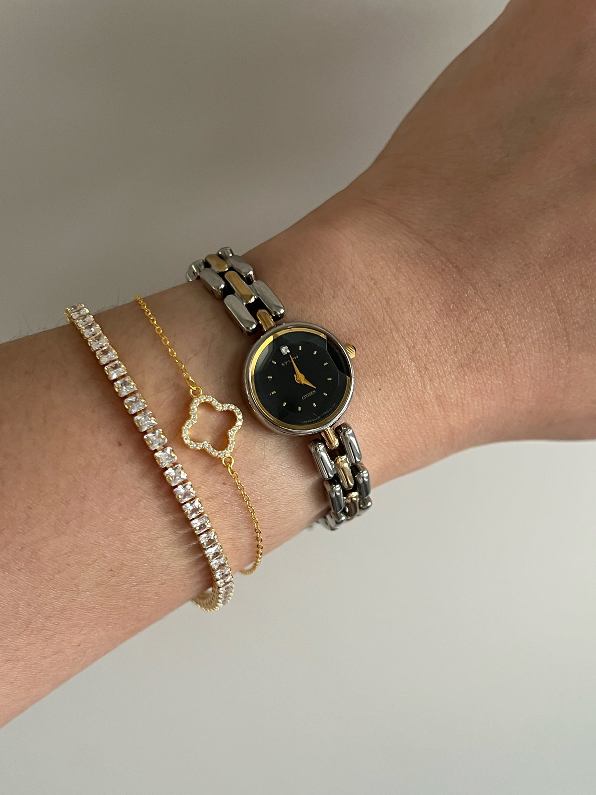 Citizen black dial two-tone women's bracelet watch with faceted crystal