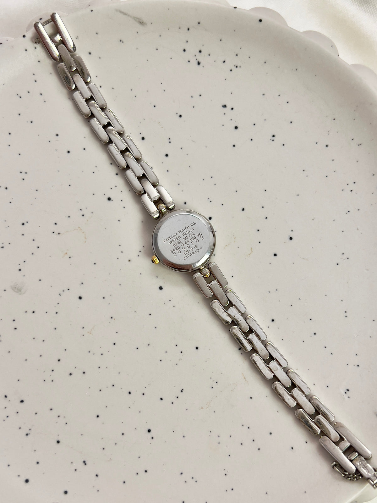 Citizen black dial two-tone women's bracelet watch with faceted crystal
