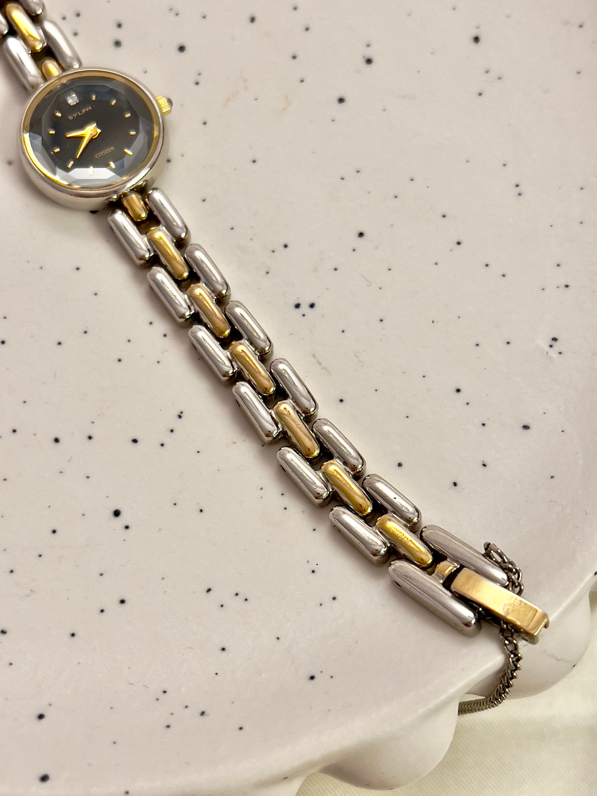 Citizen black dial two-tone women's bracelet watch with faceted crystal