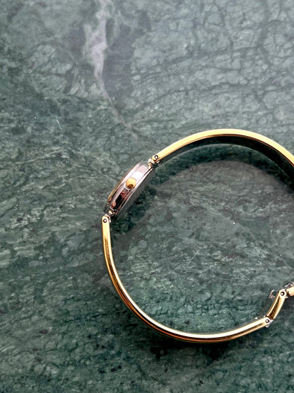 Side profile of the Citizen Chere round case and polished bangle.