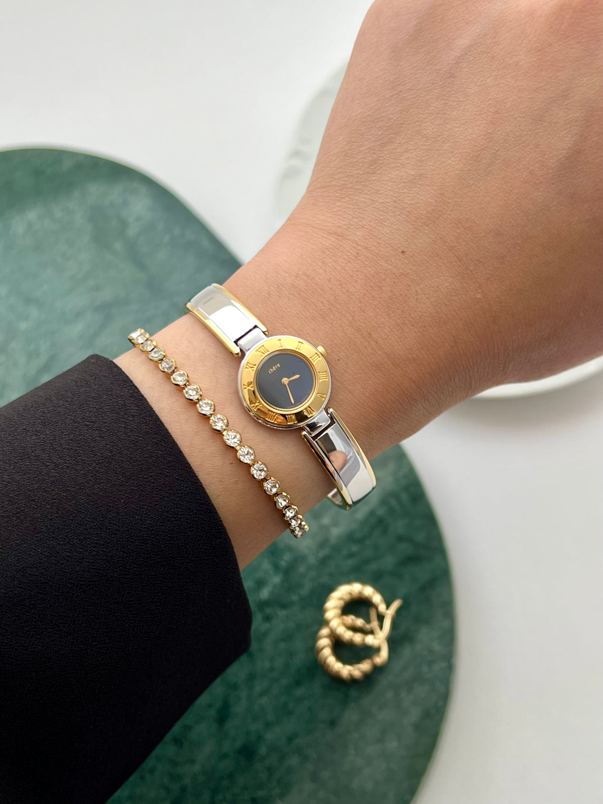 Front view of the Citizen Chere small gold and silver bangle watch.