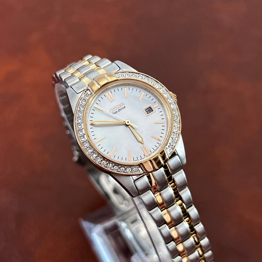Featured product image: Citizen two-tone women's watch with crystal accents and pearl dial.