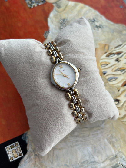 Close view of the Citizen Sylph frosted silver dial, gold tone hands, Roman numerals and two tone bracelet