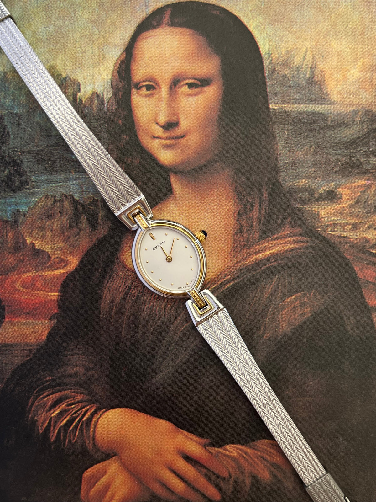 Angled view of the Citizen Sylph oval case and textured bracelet.
