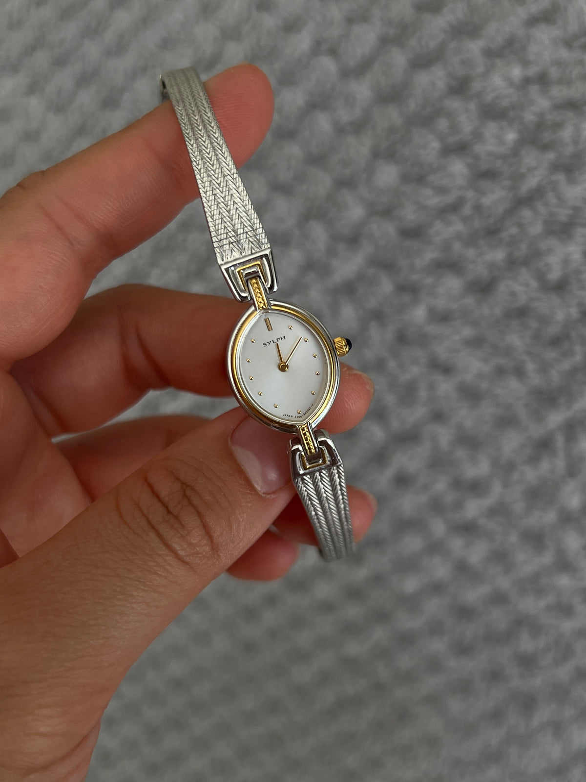 Additional wrist view of the Citizen Sylph ribbon-style two-tone bracelet.