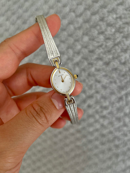Close-up of the Citizen Sylph silver dial with gold markers and baguette-cut accent.