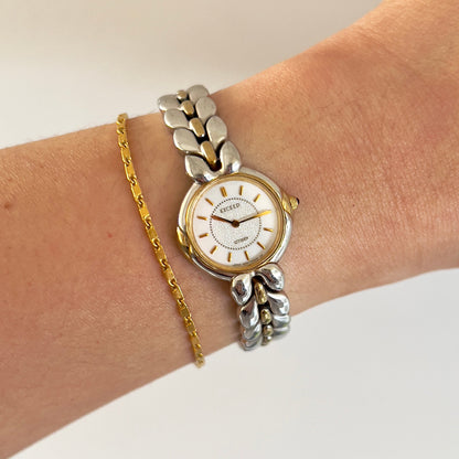 Citizen Two Tone Woman's Watch with Leaf Bracelet, Diamond Dust Dial & Blue Crown Stone — watch face and case shown from the front.