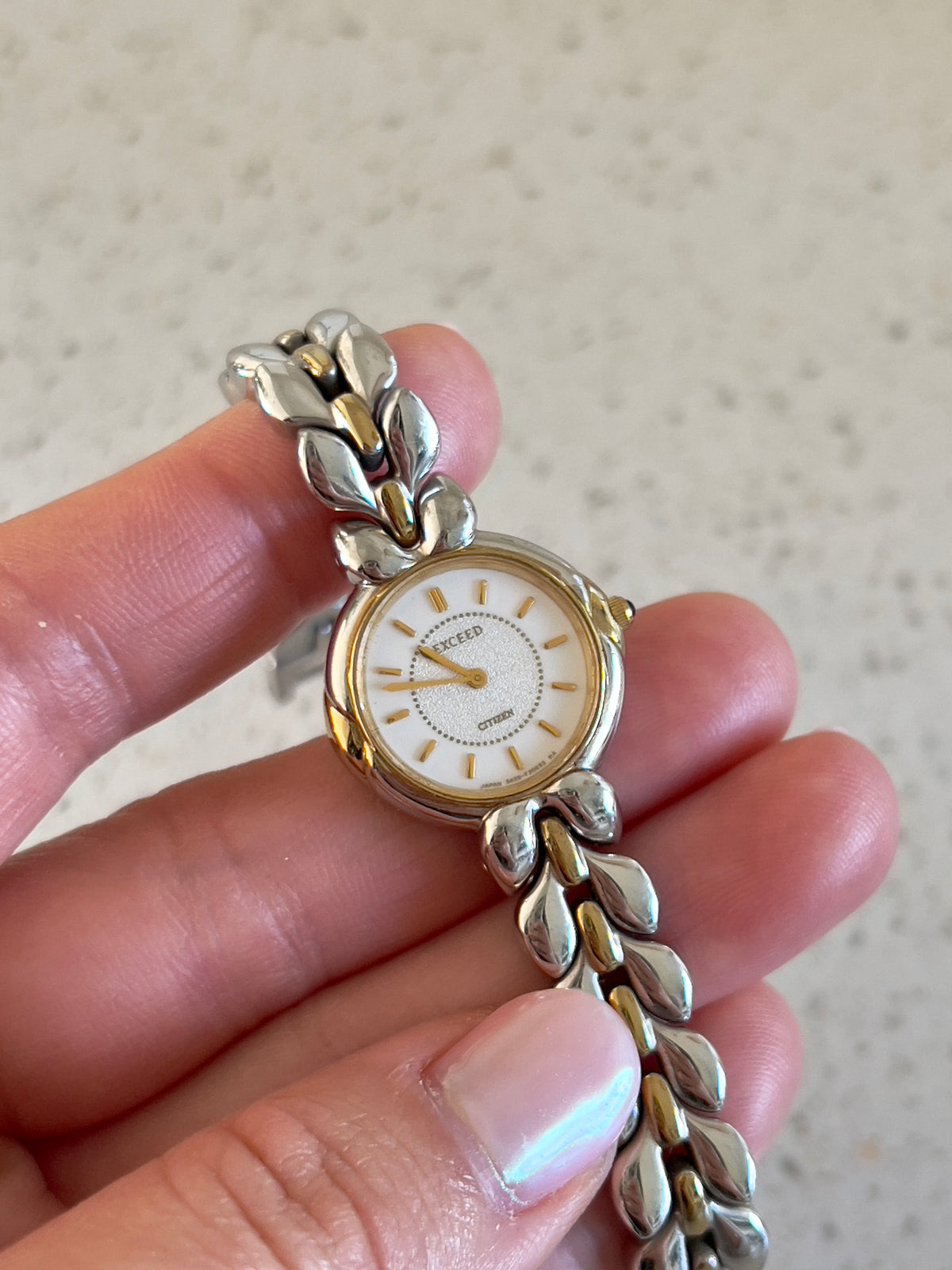 Citizen Two Tone Woman's Watch with Leaf Bracelet, Diamond Dust Dial & Blue Crown Stone, dial close up of a vintage women's watch at Gilded Hour.