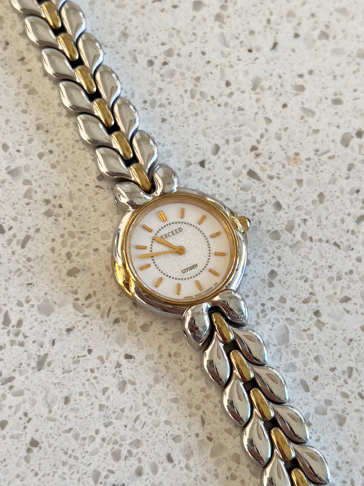 Citizen Two Tone Woman's Watch with Leaf Bracelet, Diamond Dust Dial & Blue Crown Stone, angled view of a vintage women's watch at Gilded Hour.
