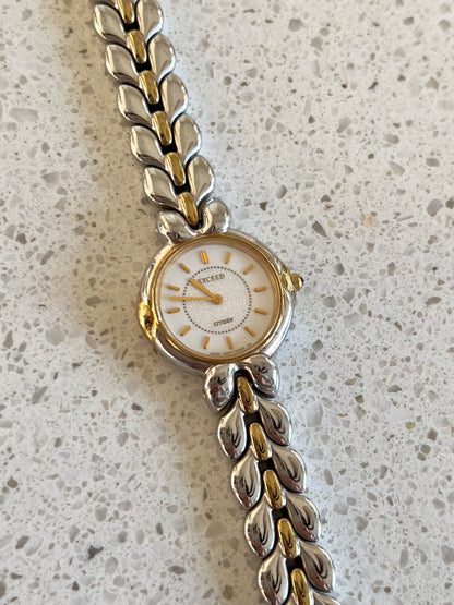 Citizen Two Tone Woman's Watch with Leaf Bracelet, Diamond Dust Dial & Blue Crown Stone, wrist shot of a vintage women's watch at Gilded Hour.