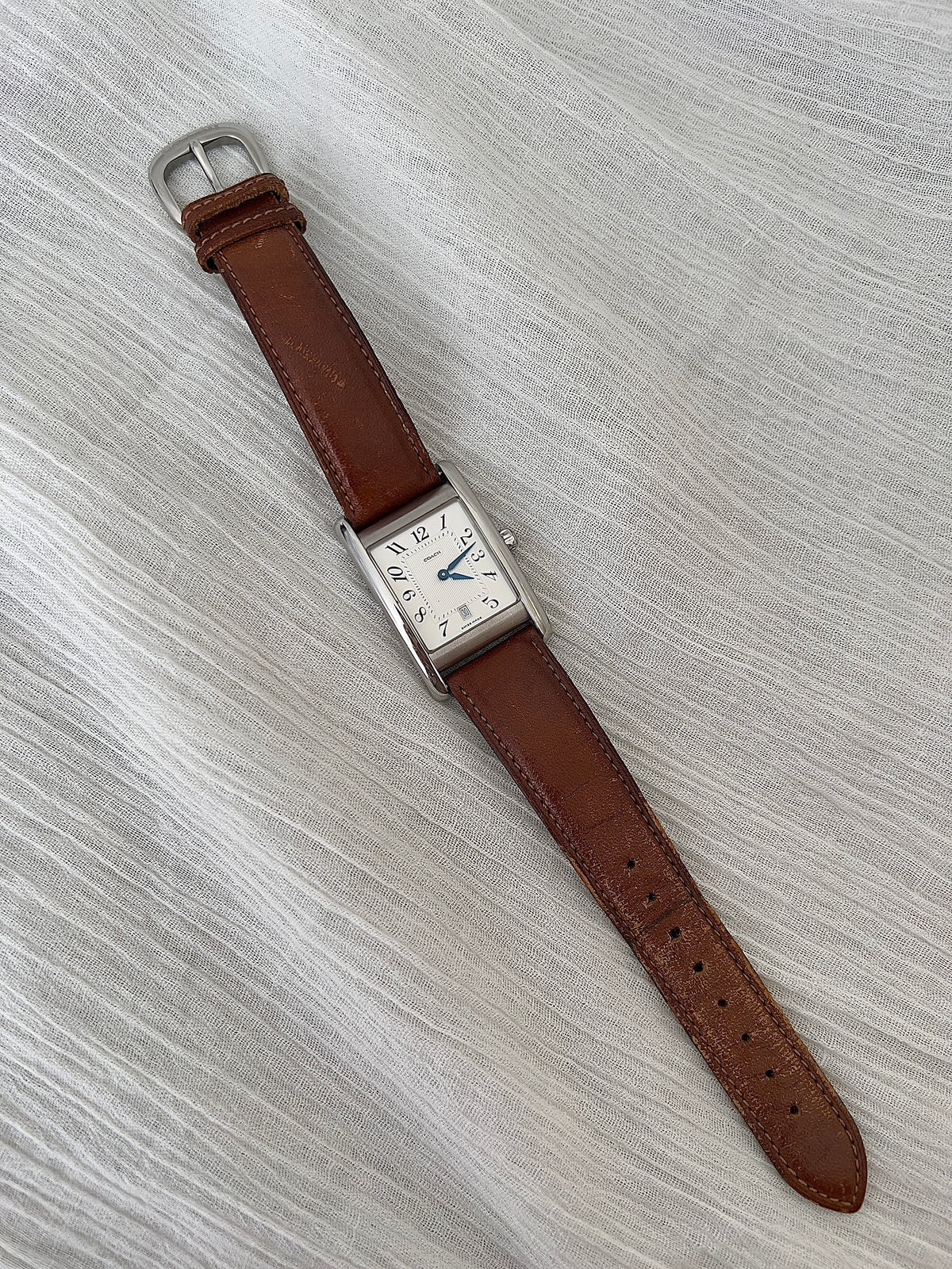 Detail of the original Coach leather strap with decorative top stitching.