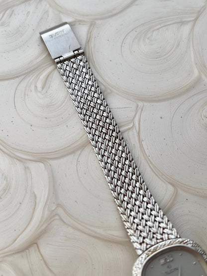 Elgin Silver Woman's Watch with Crystal Accent — detail of the case and band.