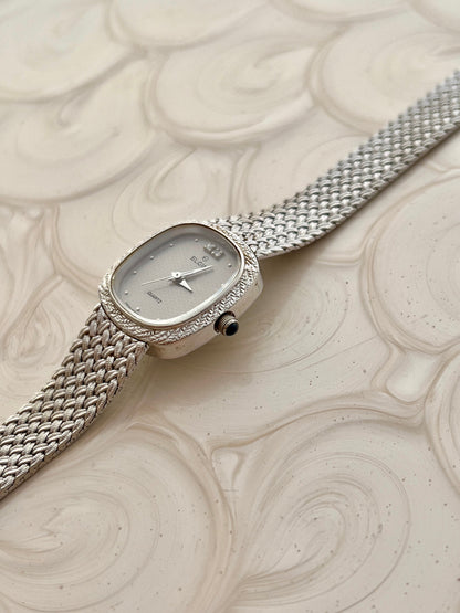 Elgin Silver Woman's Watch with Crystal Accent — close view of the watch band and clasp.