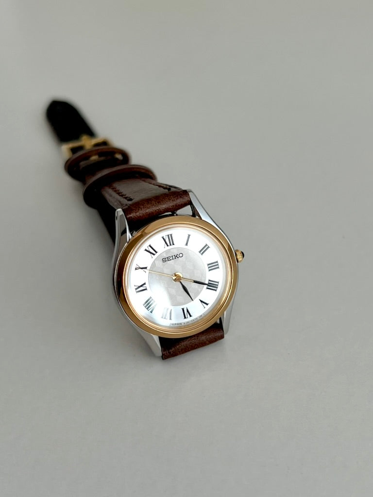 Seiko Exceline mother of pearl dial centre catching the light inside a white Roman numeral chapter ring