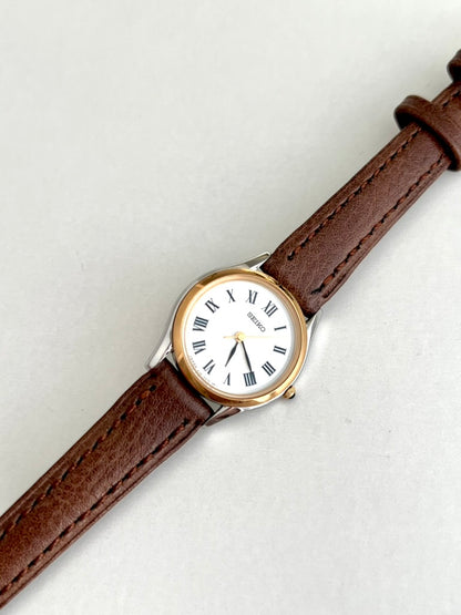 Seiko Exceline black Roman numeral markers, slim gold seconds hand and gold tone crown