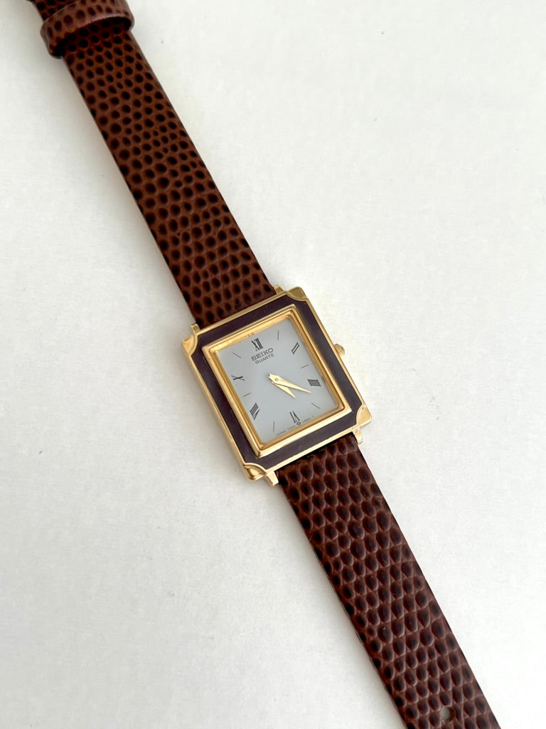Seiko Brown Frame Roman Dial Leather Strap Watch: full watch laid diagonally.