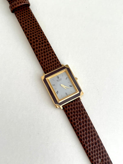 Seiko Brown Frame Roman Dial Leather Strap Watch: full watch laid diagonally.