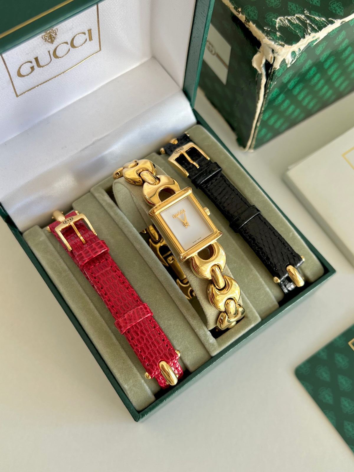 Gucci 1800L gold tone watch with Horsebit bracelet and interchangeable leather straps