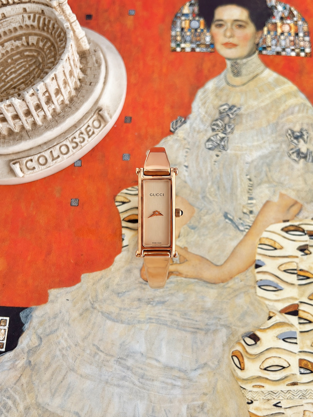 Gucci women’s rectangular champagne dial watch with a rose gold tone bangle, photographed on a colourful art print