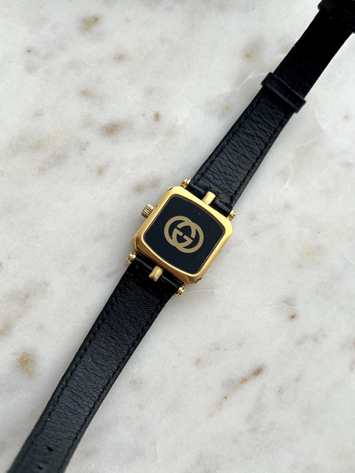 Gucci Sherry square watch black case back with gold tone GG emblem