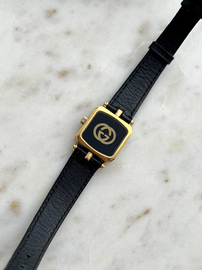 Gucci Sherry square watch black case back with gold tone GG emblem