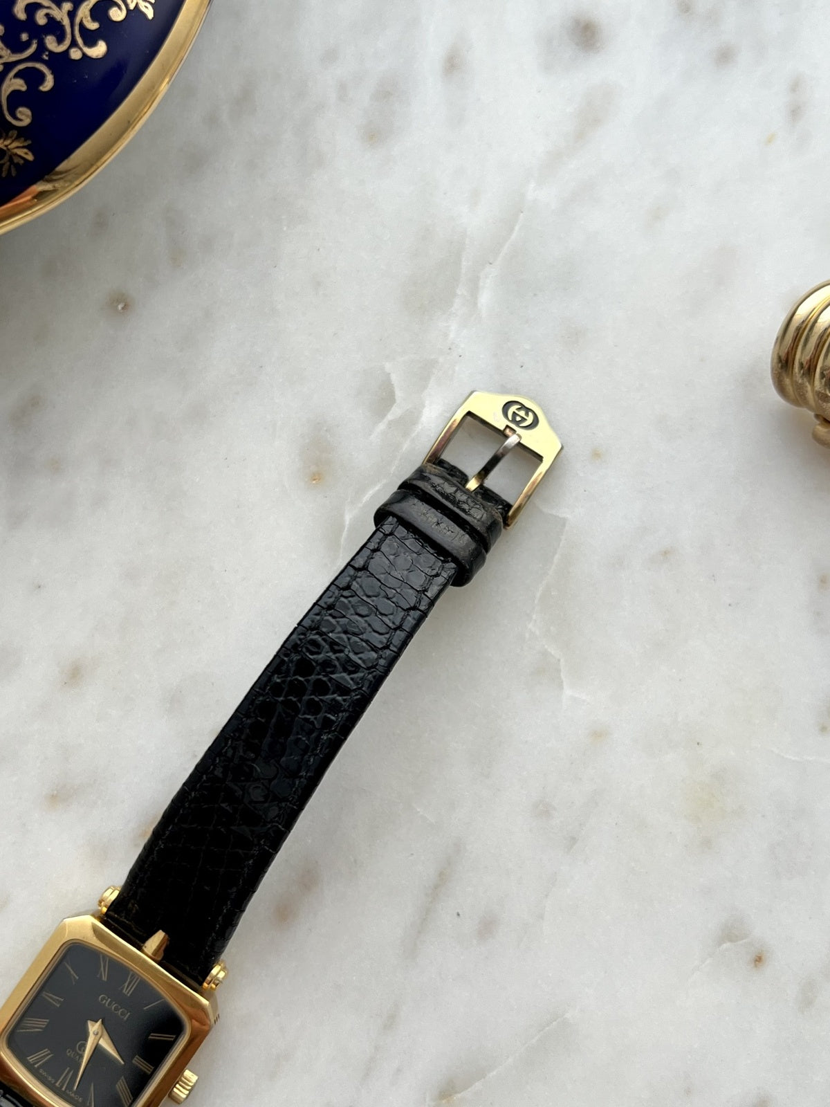 Gucci Sherry square watch black leather strap and signed gold tone GG buckle