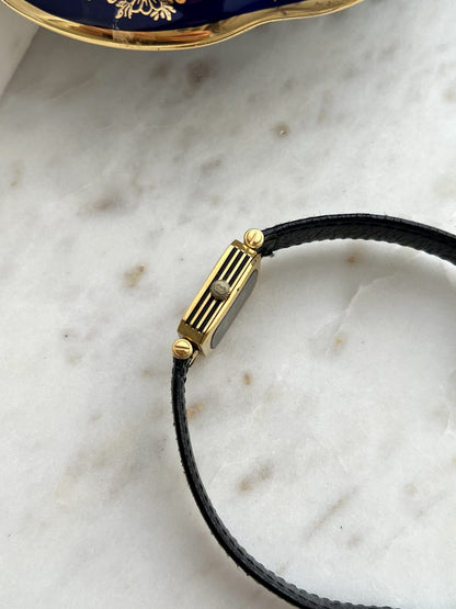 Gucci Sherry square watch gold tone case profile with three black stripes and winding crown