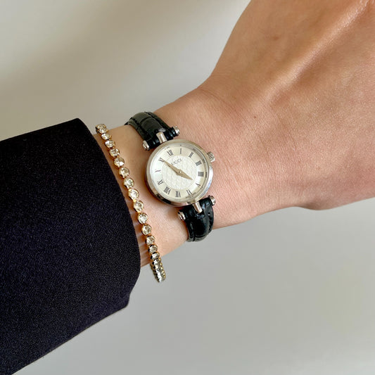 Gucci Sherry white Roman dial silver women’s watch, on a wrist