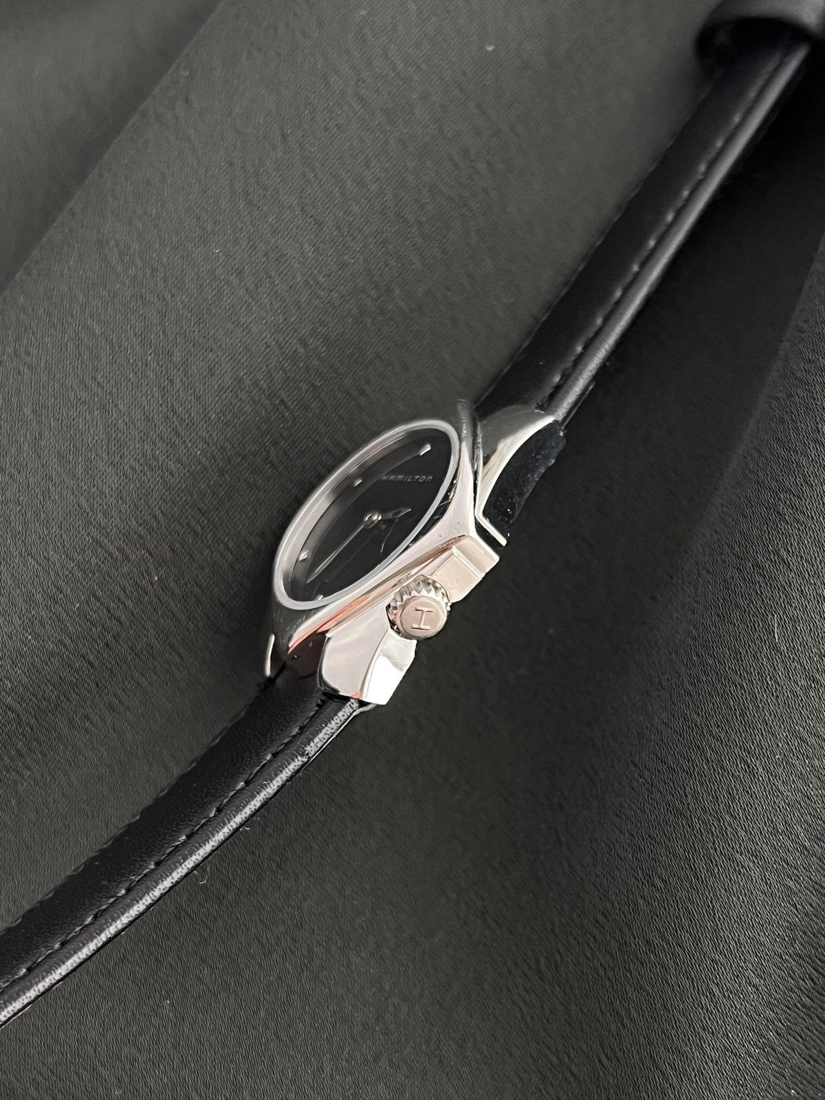 Side profile of the Hamilton Stardom 6357 showing the polished angular case and ridged crown