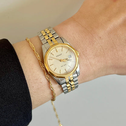 Tissot PR 100 pinstripe dial Women’s watch with two tone bracelet