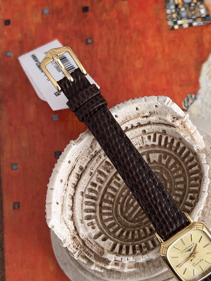 Gold tone pin buckle and brown patterned leather strap fitted to the Longines cushion watch.