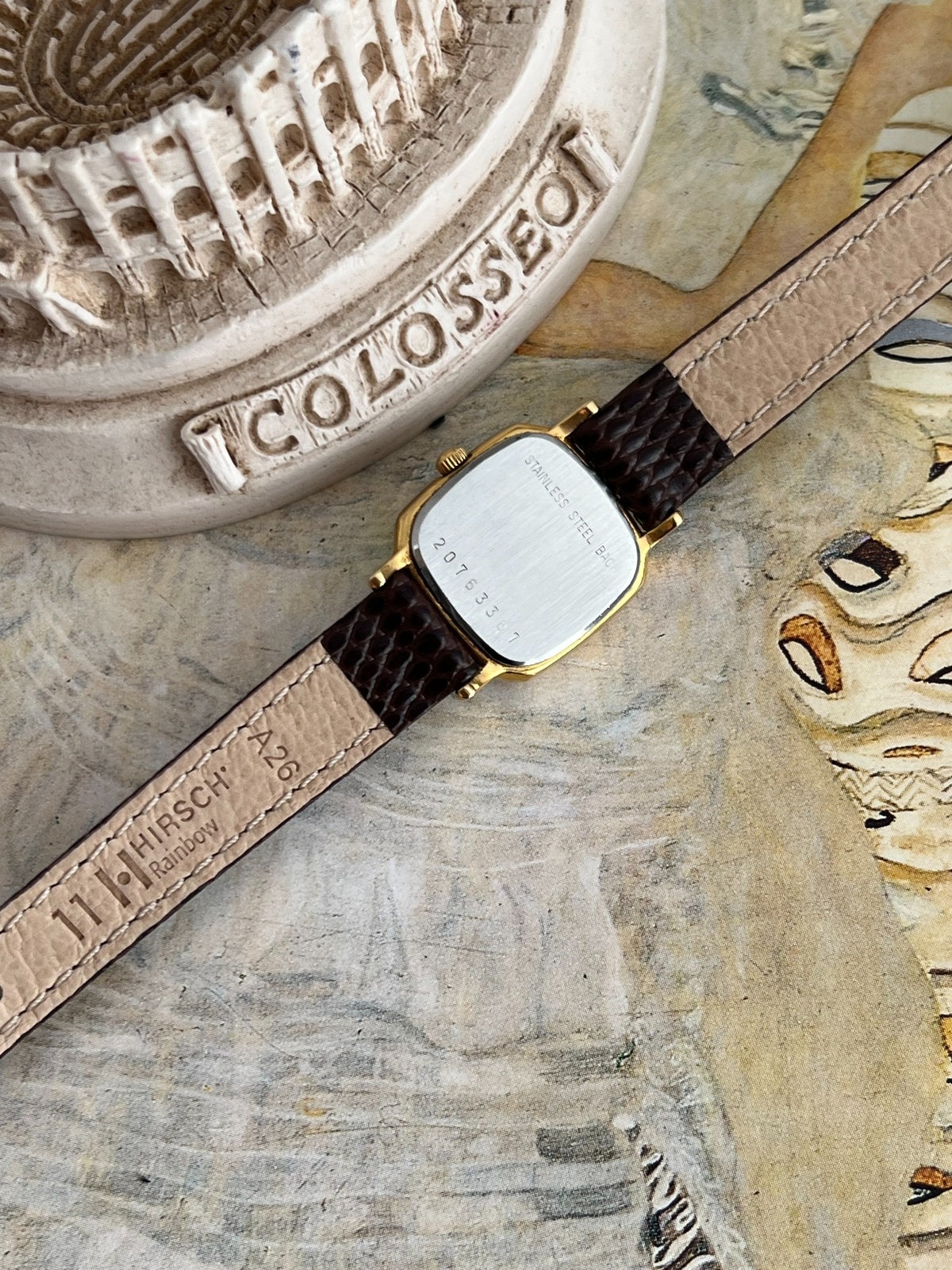 Longines stainless steel caseback with serial 20763367 and Hirsch signed leather strap underside.