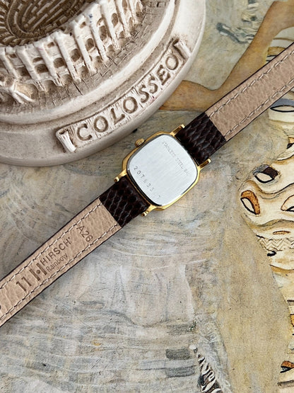 Longines stainless steel caseback with serial 20763367 and Hirsch signed leather strap underside.