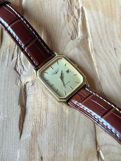 Longines Champagne Textured Bezel Women’s Watch — Angled view of the dial and stitched leather strap