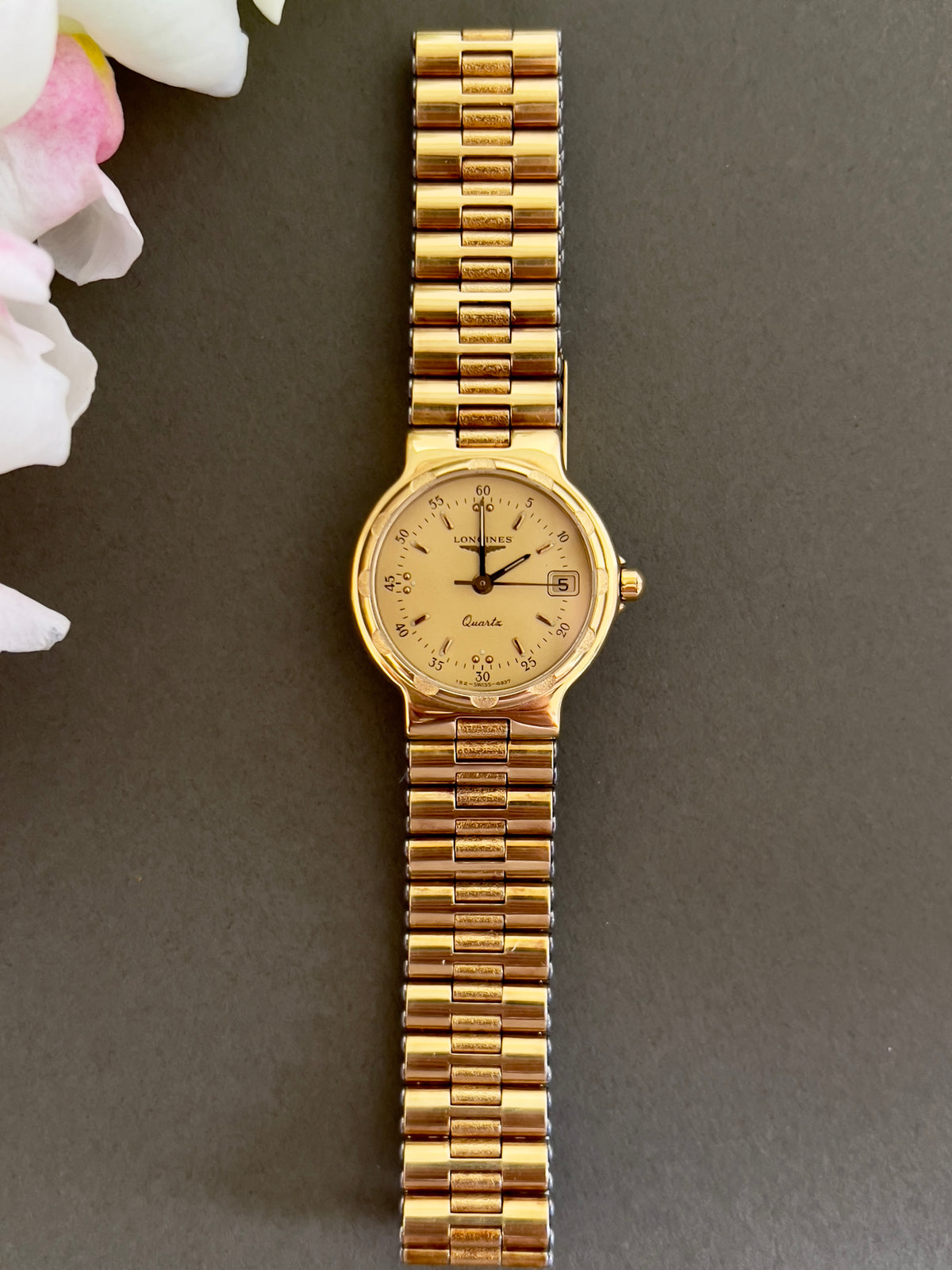 Longines Conquest Gold Women’s Watch with Scalloped Bezel — full Conquest watch and gold bracelet.