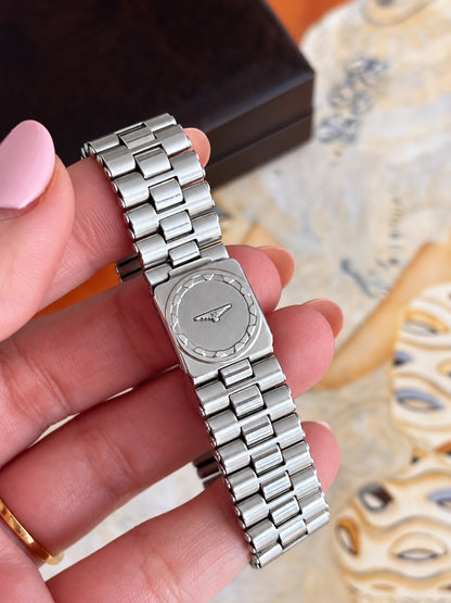 Longines Conquest silver tone link bracelet and folding clasp with a winged hourglass emblem.